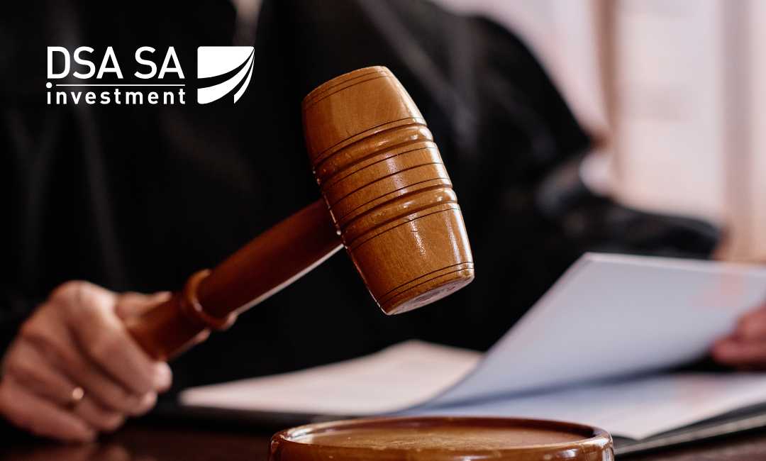 Judicial gavel and documents on a desk with the DSA SA Investment logo in the corner